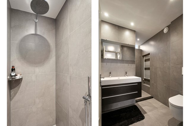 De geheel betegelde badkamer is vorig jaar helemaal vernieuwd en heeft naast het badmeubel en 2e toilet een hele mooie inloopdouche, designradiator en thermoskranen.