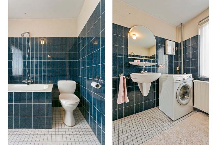 Ver der een 2e toilet en een wastafel met een spiegel. Hier bevindt zich ook de aansluiting voor de wasapparatuur. 